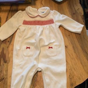 White velvet one piece with red smocking